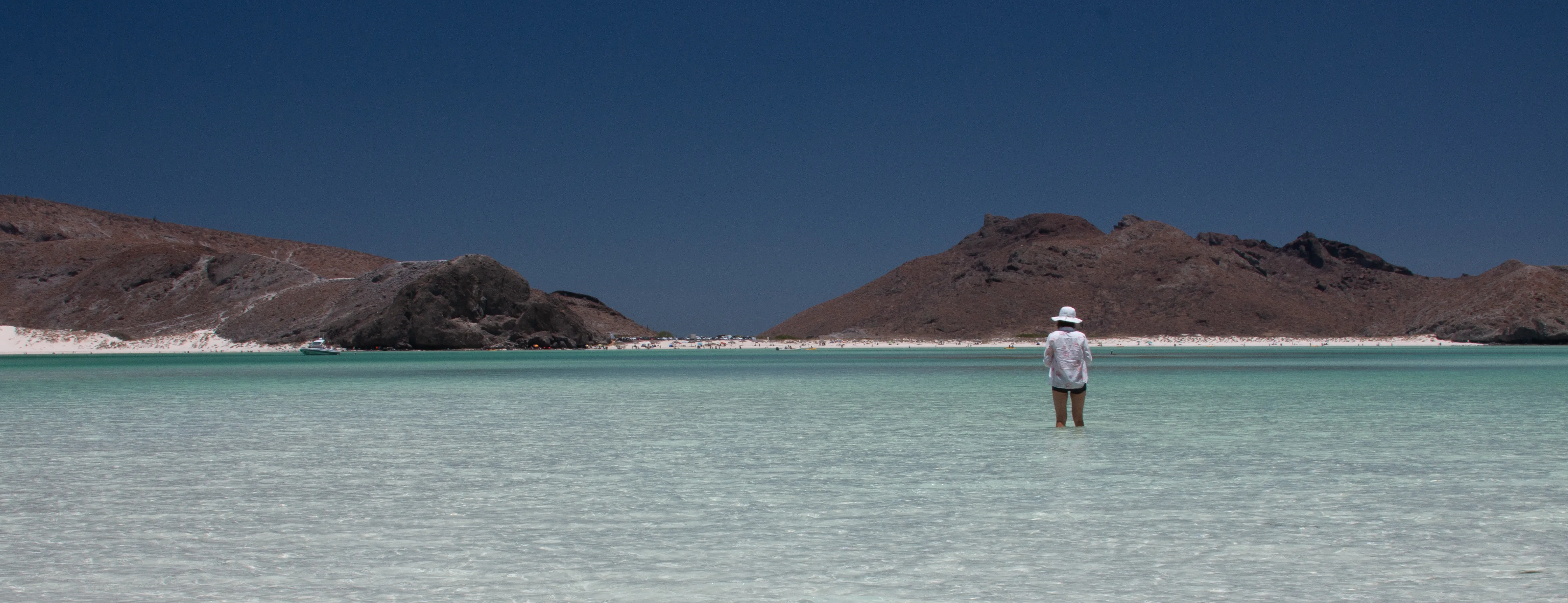Turquoise bay with a person in the water