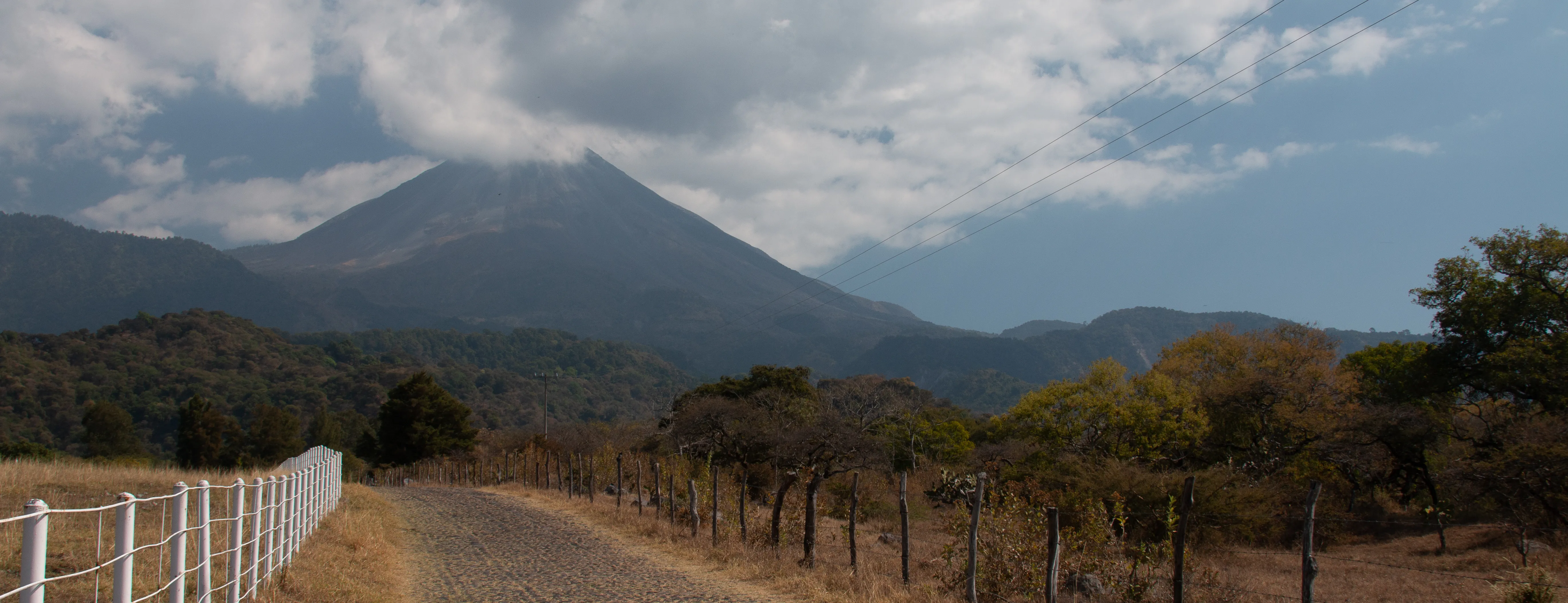 A road leading to a volcano in a jungle